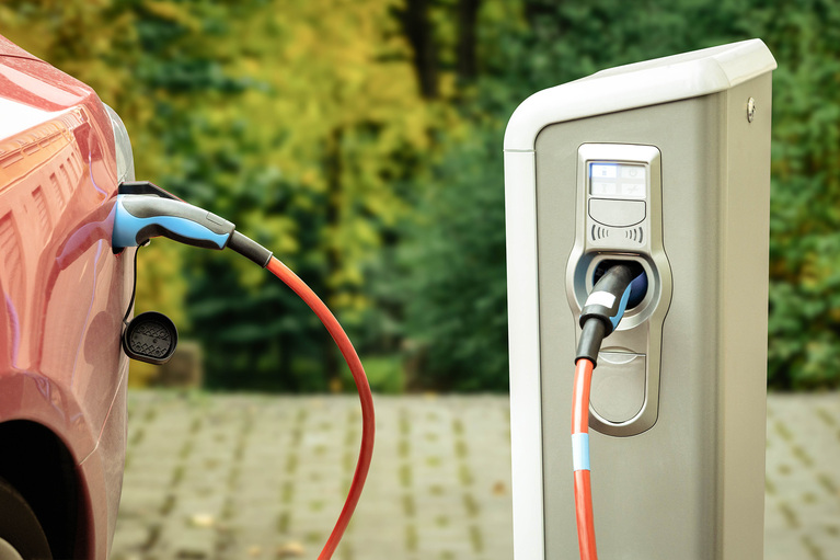 Electric car plugged in image